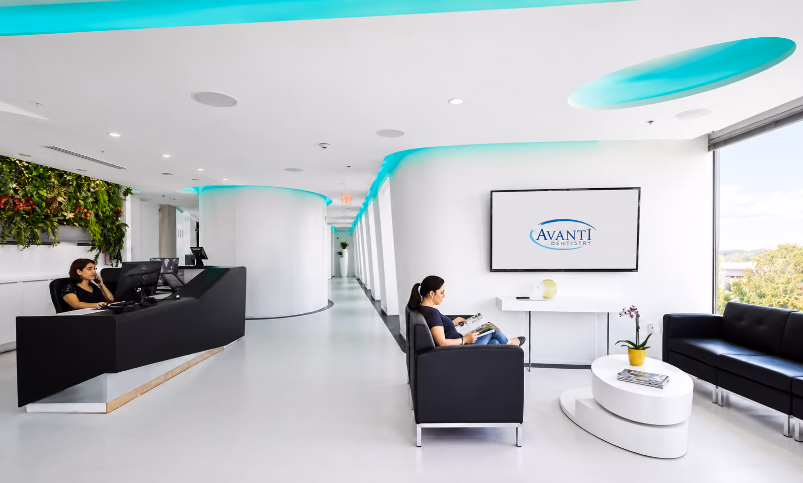 Modern clinic waiting area with a receptionist desk, seating, and a screen displaying Digital Clinic.