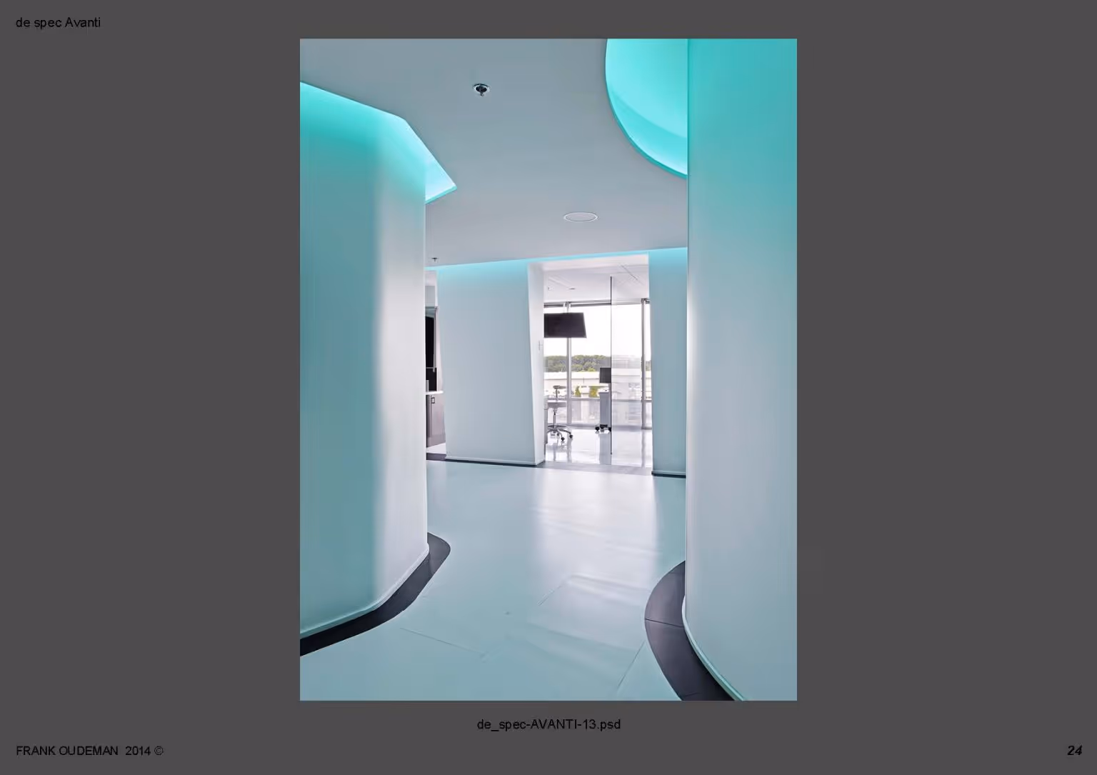 Modern interior hallway with curved white walls and turquoise LED ceiling lighting.