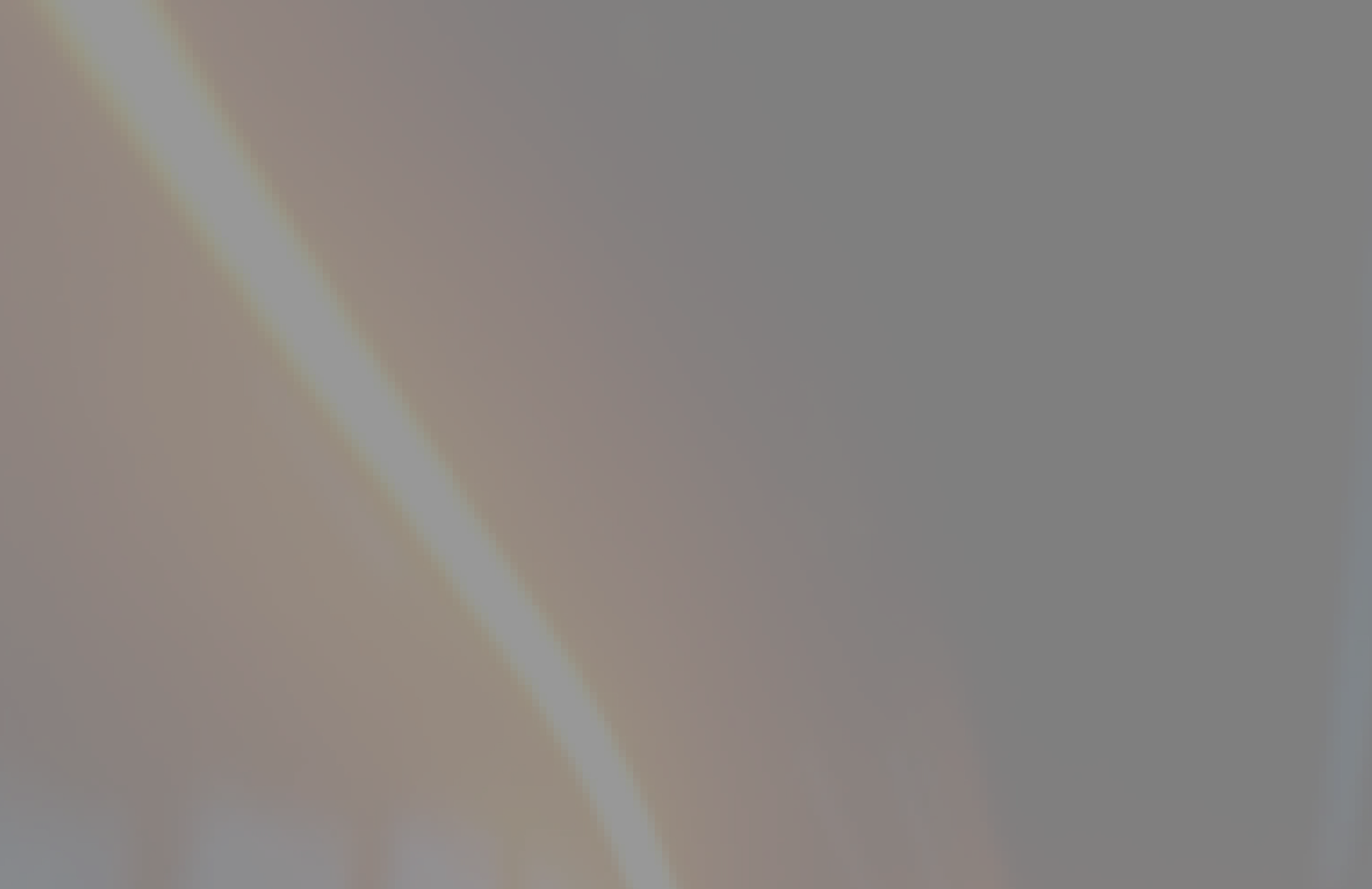Dark abstract background with a curved glowing orange line and a diagonal bright streak.
