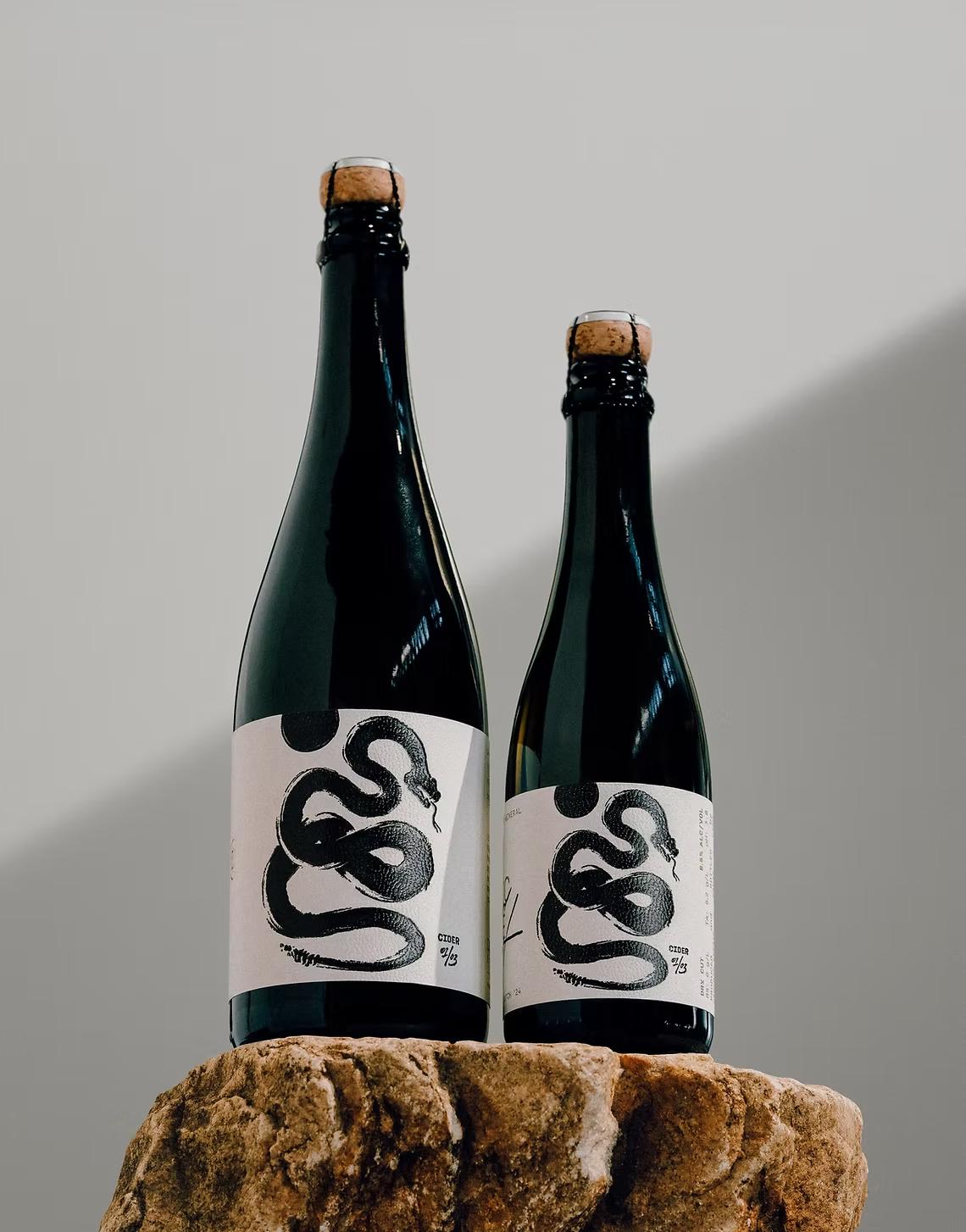Two bottles of Dry Cut cider on stone