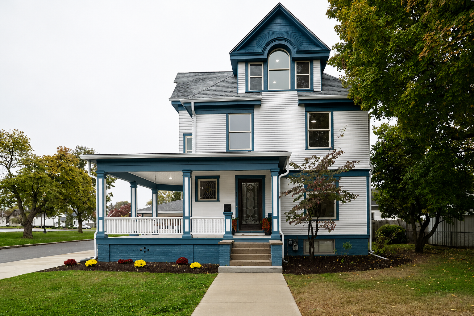 Historic two-story home with restored covered porch renovated by JCZ Residential in Martinsville, Indiana