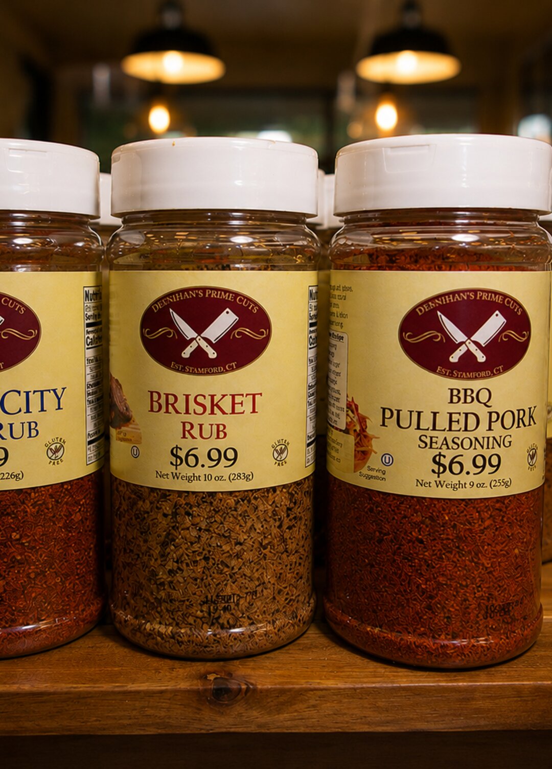 Deenihan's Prime Cuts BBQ rubs on display, Kansas City Steak Rub, Brisket Rub, and BBQ Pulled Pork Seasoning