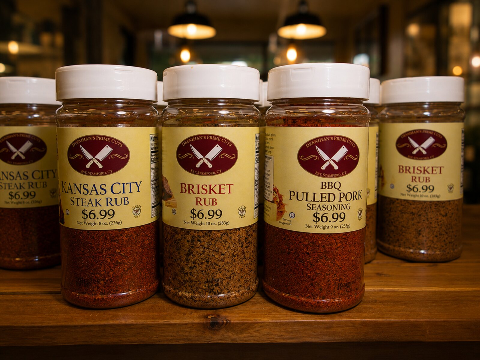 Deenihan's Prime Cuts BBQ rubs on display, Kansas City Steak Rub, Brisket Rub, and BBQ Pulled Pork Seasoning