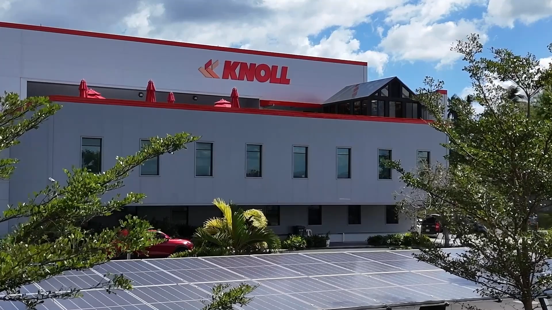 Sustainable packaging manufacturing facility with solar panels and rainwater harvesting