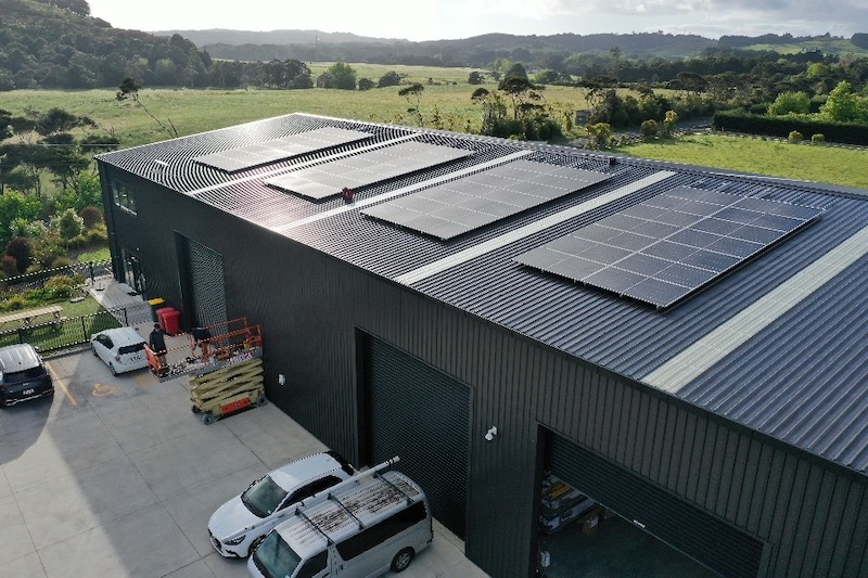 Commercial building exterior with solar panel array on the roof