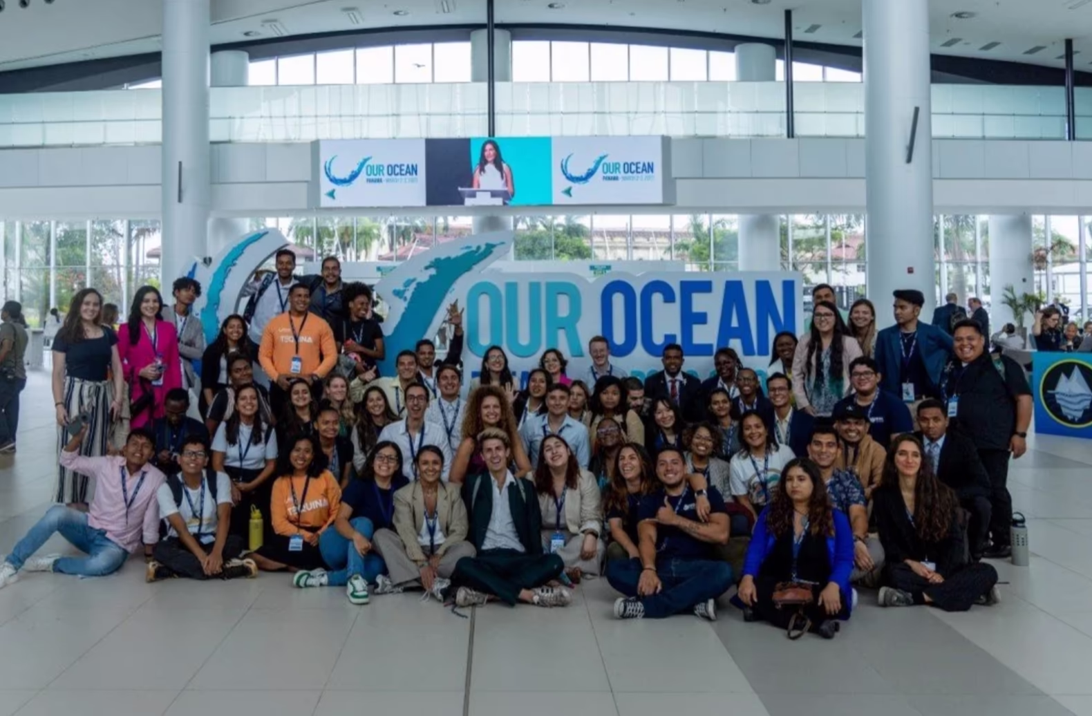 Emily with fellow youth at the airport attending the Our Ocean Conference.