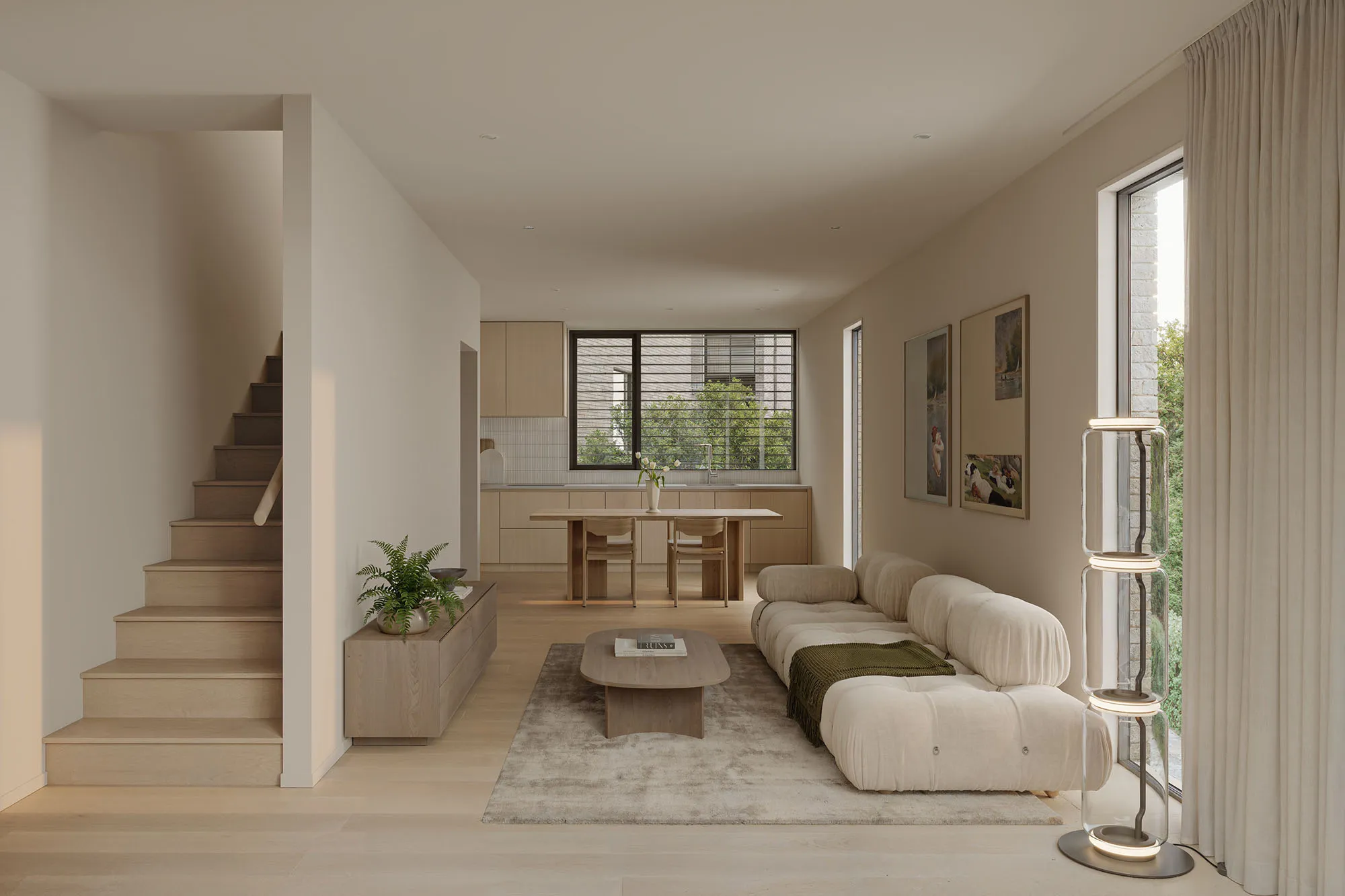Open-plan living, dining and kitchen at Enclave with a staircase and full-height windows