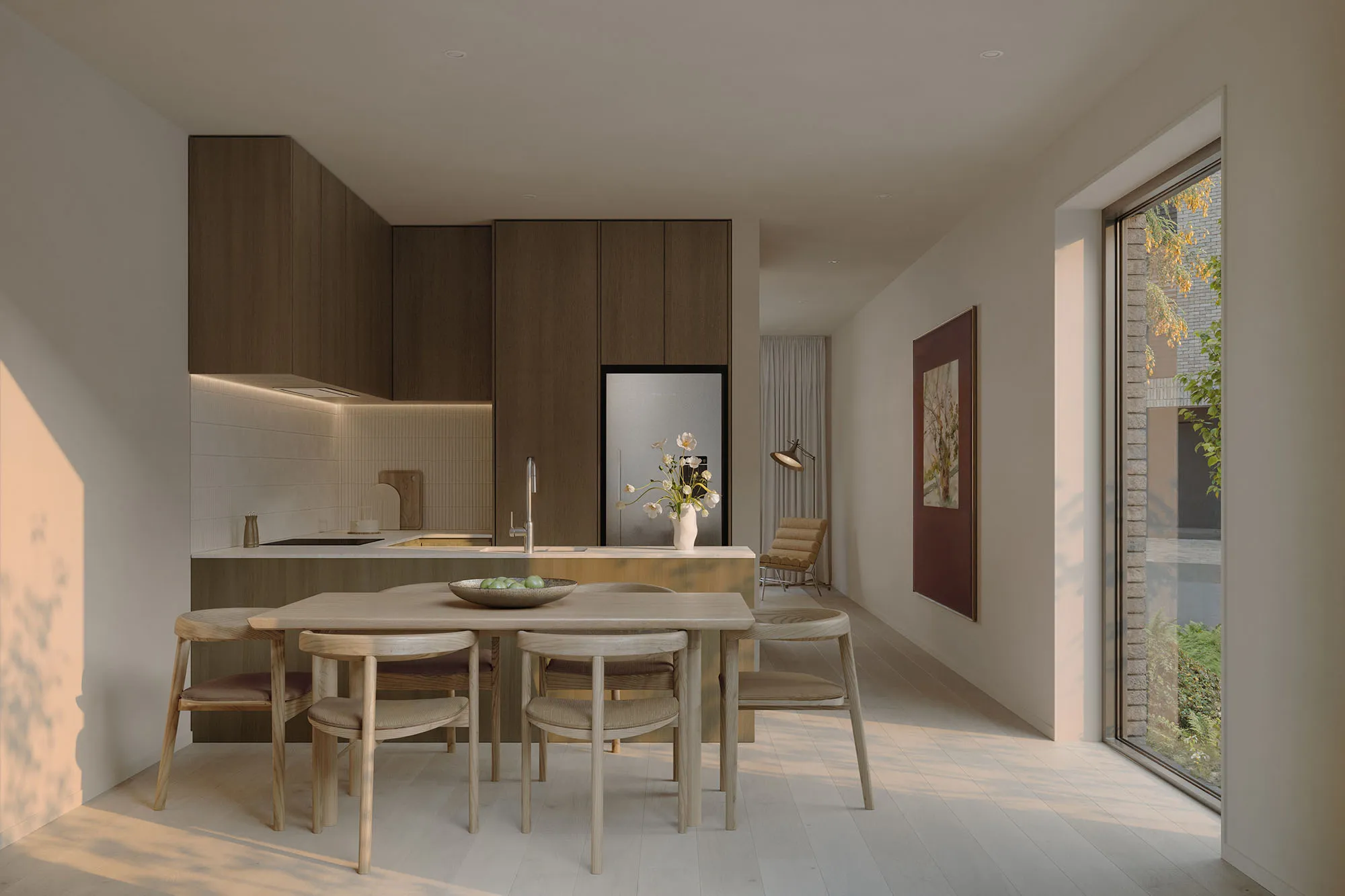 Open-plan Enclave kitchen and dining in a darker palette with oak joinery and timber floors