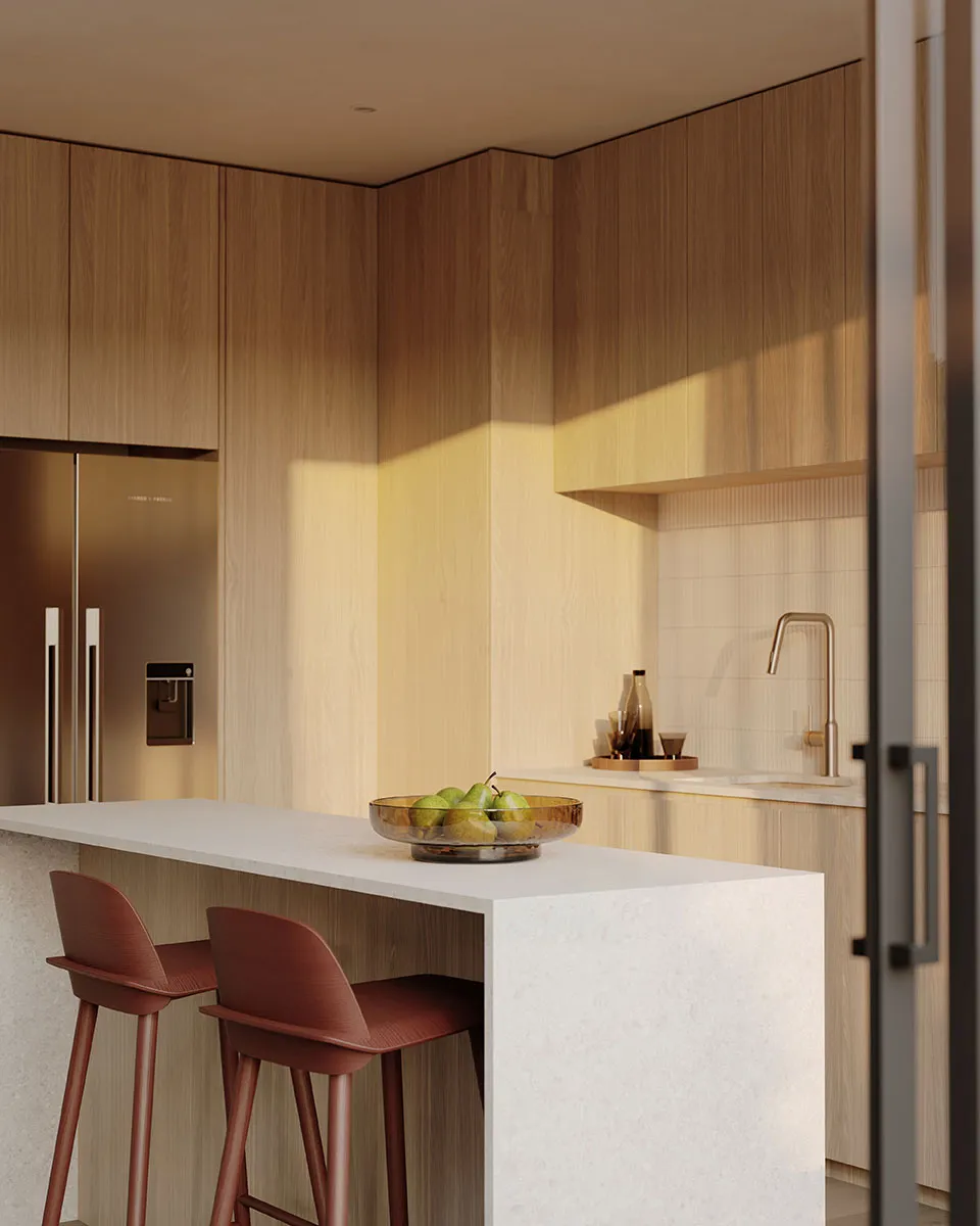 Oak kitchen cabinetry and stone breakfast bar in a light Enclave residence