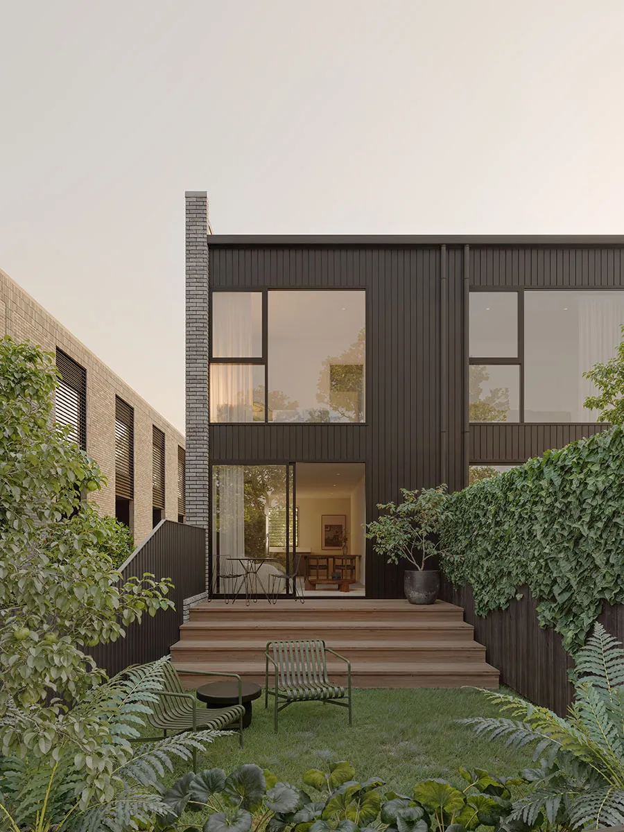 Private rear courtyard at Enclave with a timber deck, dark cladding and established planting