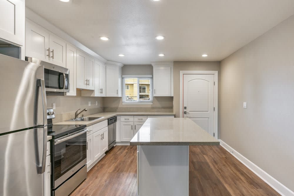 Kitchen with white cabinets and stainless steel appliances