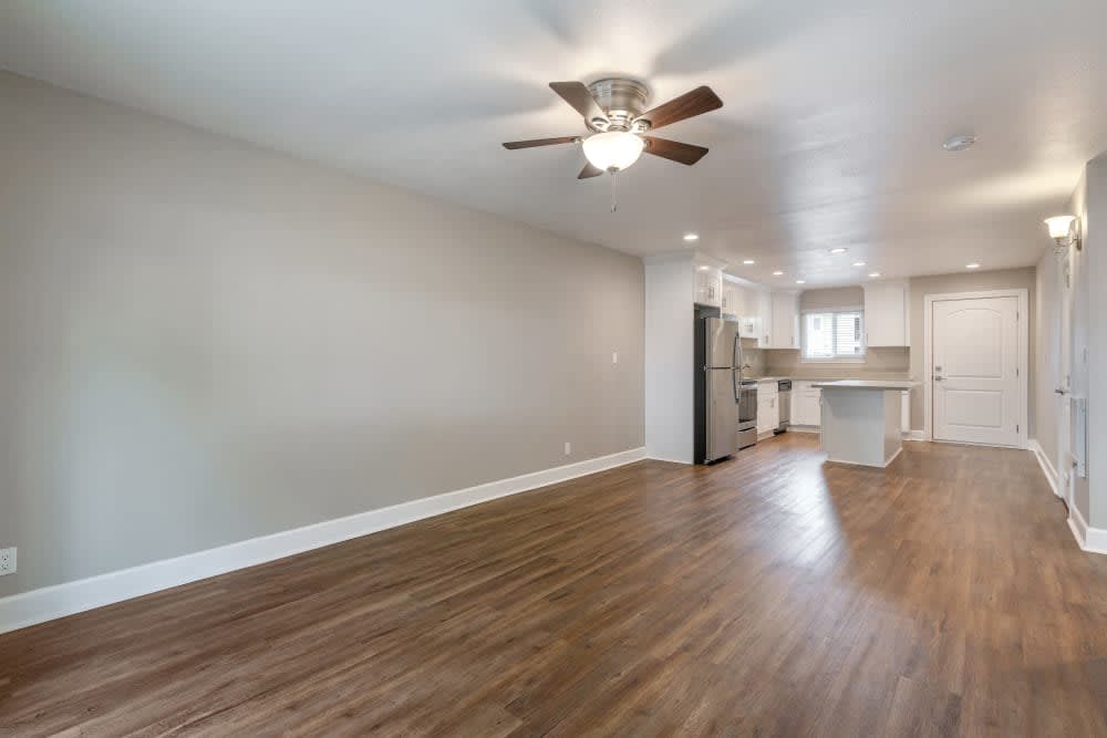 Unfurnished living area with view of kitchen