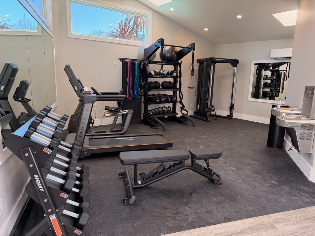 Fitness center with cardio and weight lifting equipment and 2 drinking fountains