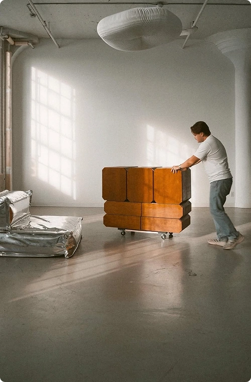 A guy is moving furniture