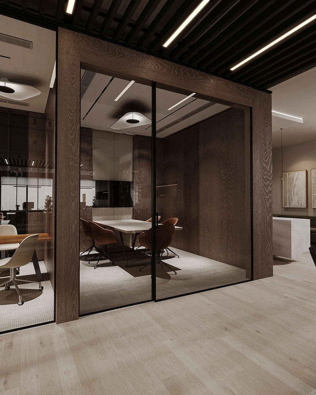 A walnut and glass private office pod inside an open office floor