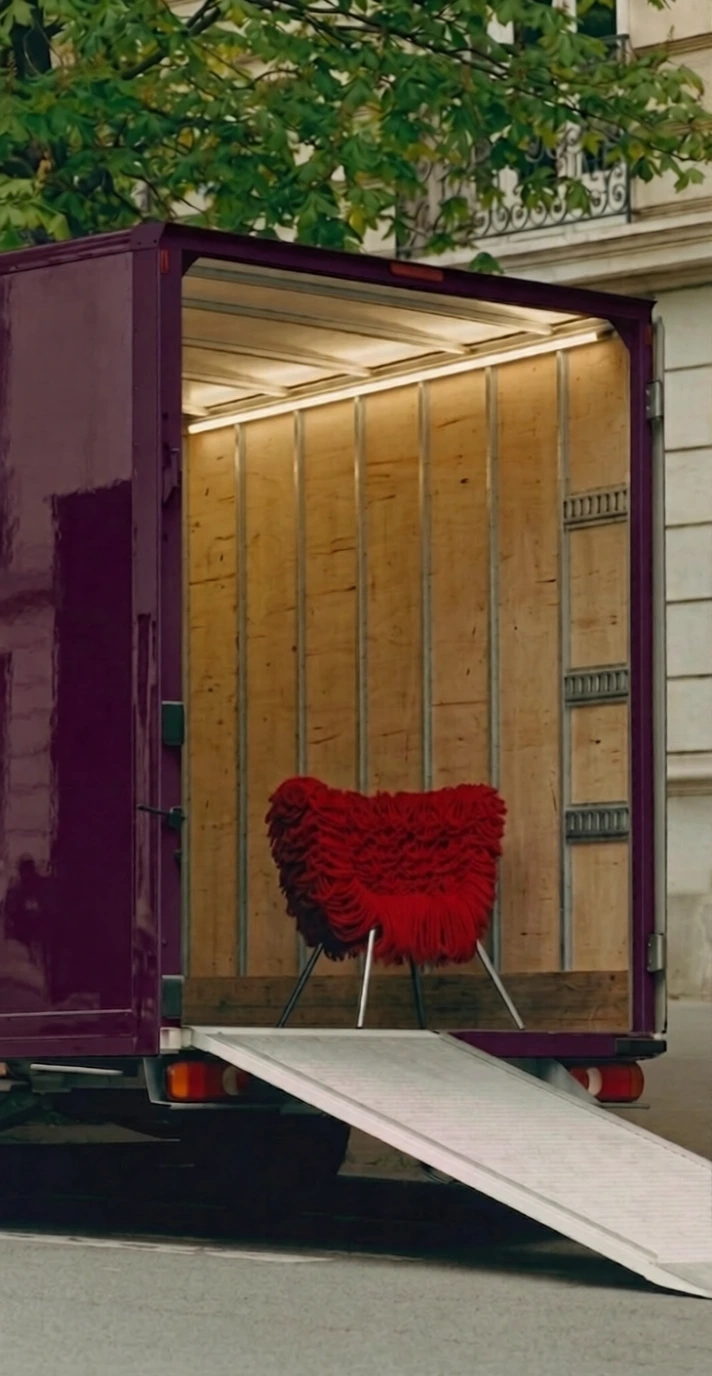 A lady is standing next to a wall