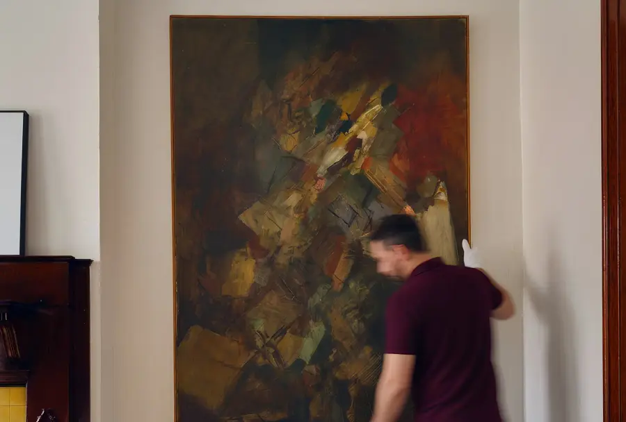 Hanging a client's painting