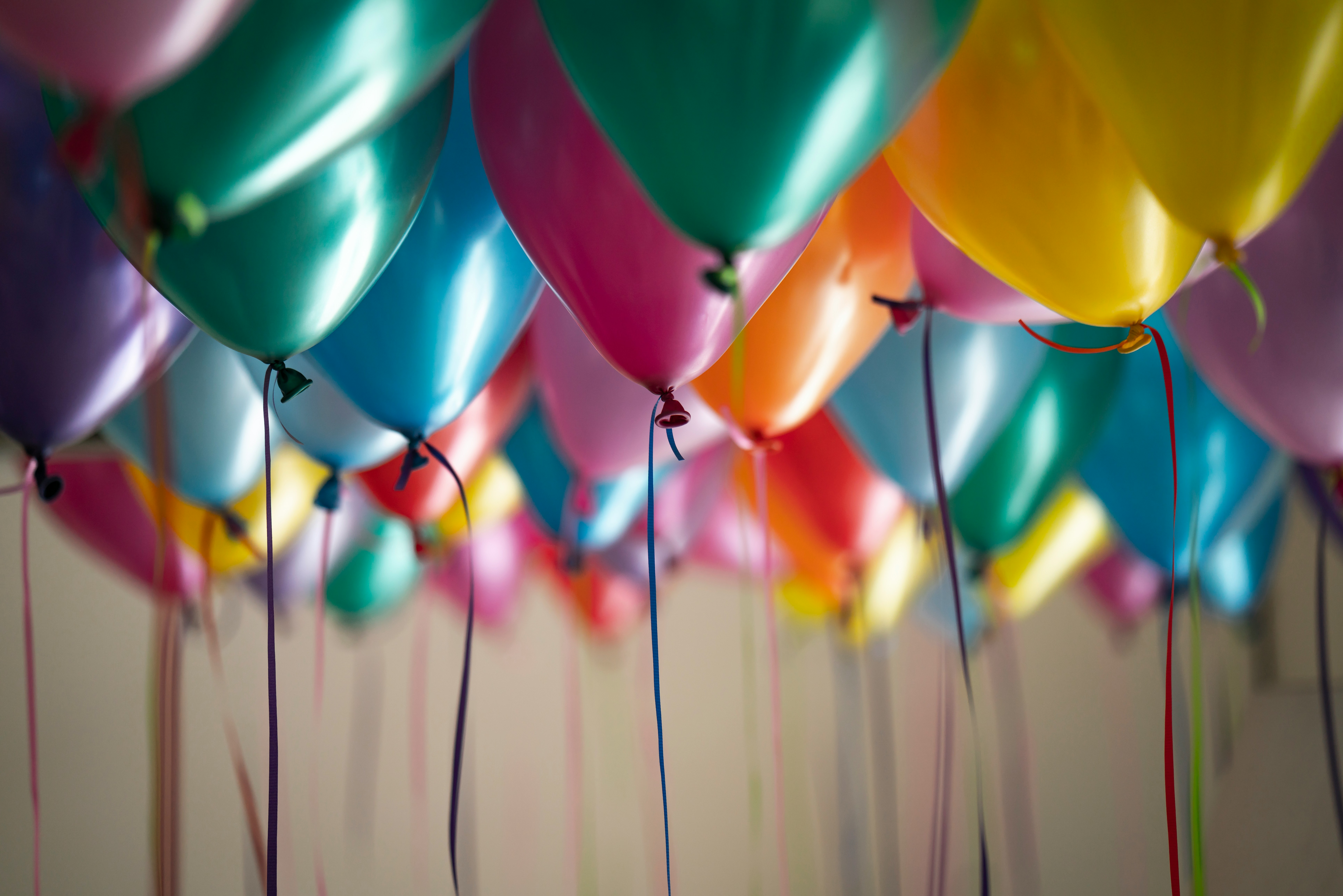 Colorful balloons hanging from the ceiling for a birthday party