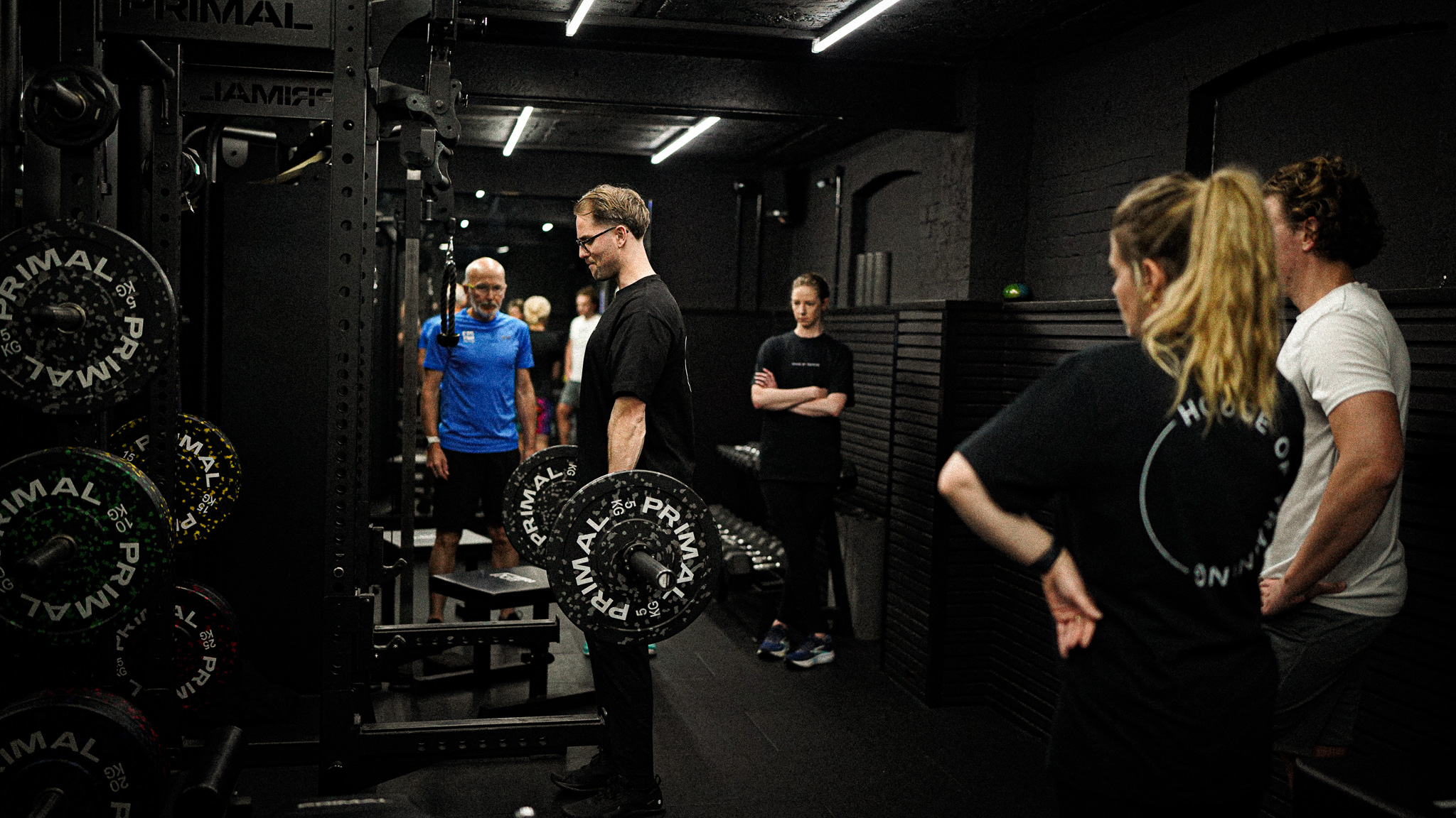 House of Training personal trainer training client in the gym