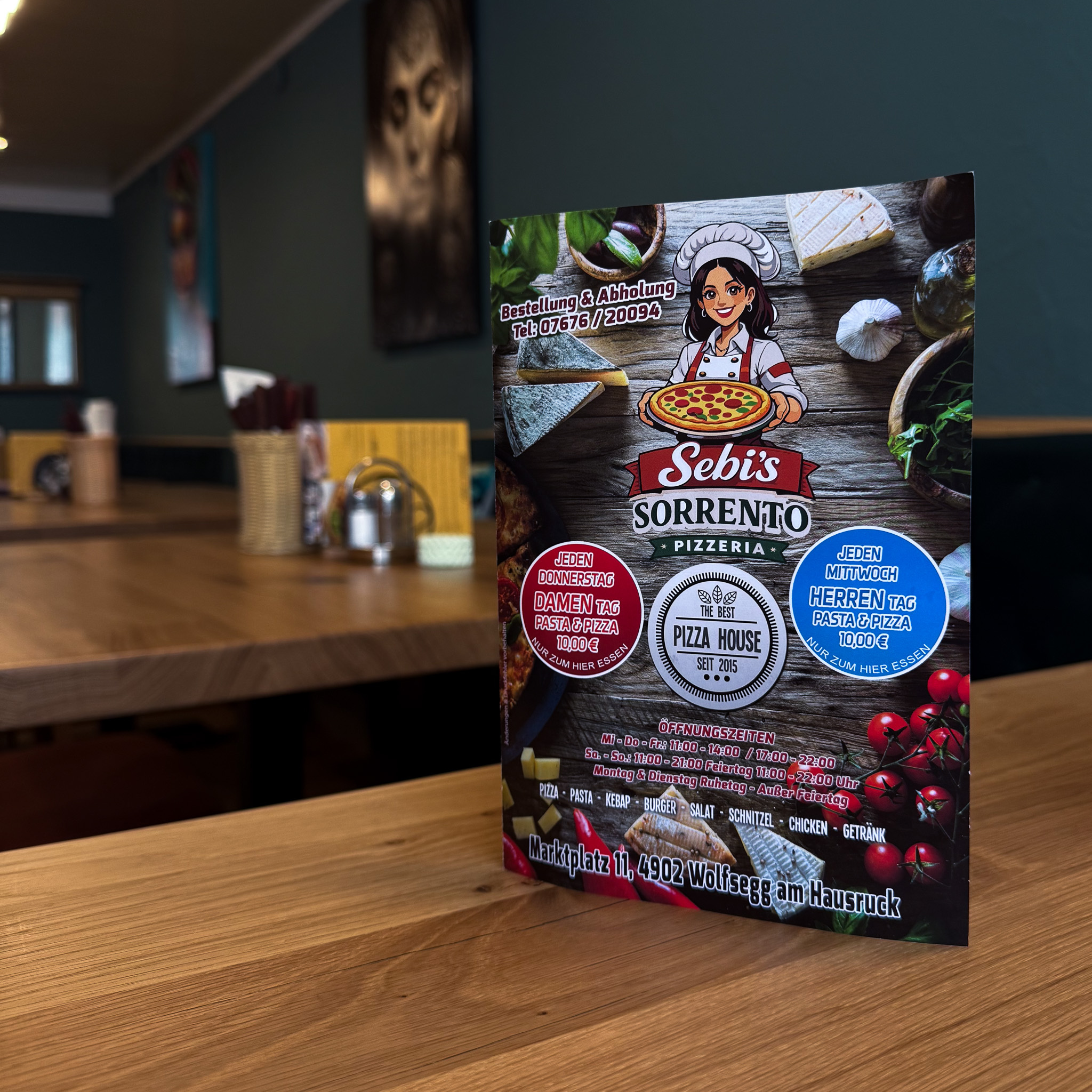 Werbeflyer von Sebi's Sorrento Pizzeria mit Angeboten, Öffnungszeiten und Adresse in Wolfsegg.