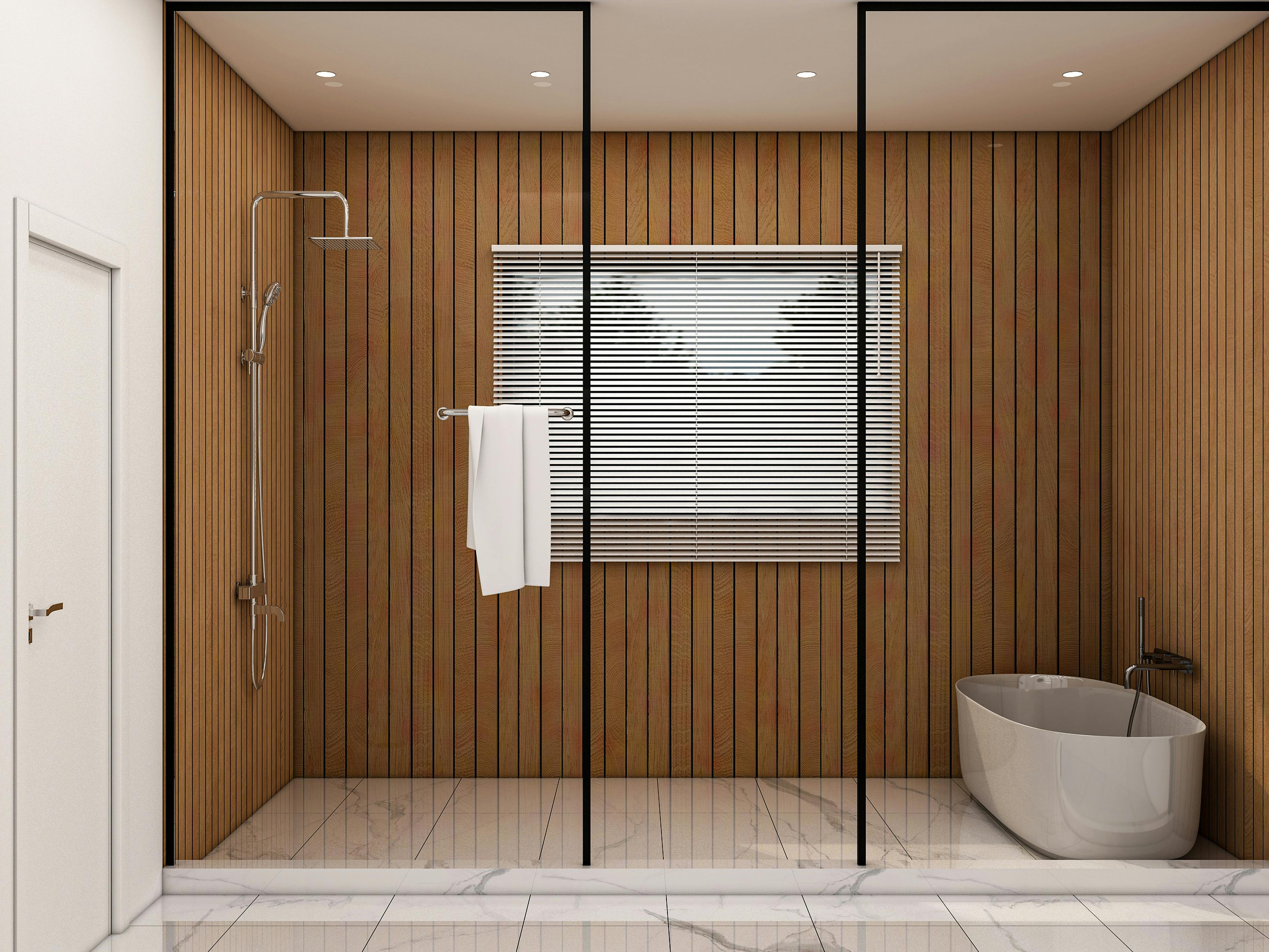 Modern bathroom with wood-paneled walls, a glass-enclosed shower with towel rack, and a freestanding bathtub on marble tile flooring.