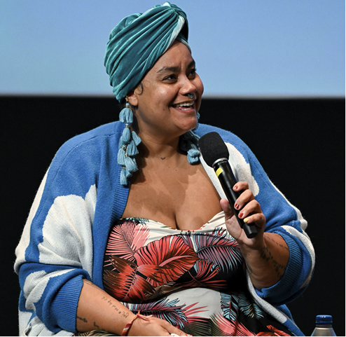 adrienne speaking at an event
