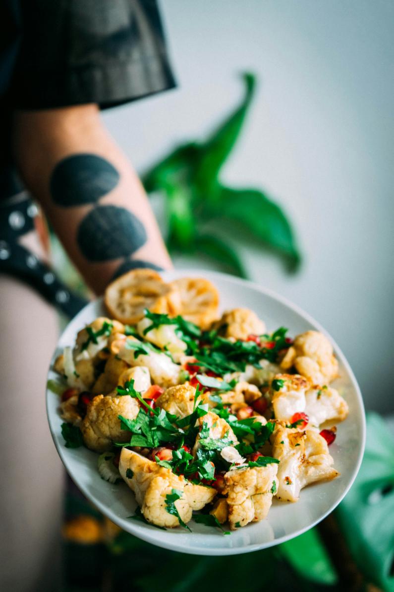 Bowl of roast cauliflower and tempeh with tahini dressing