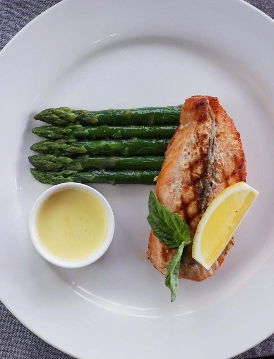 Pan-fried trout fillet with crispy skin topped with toasted flaked almonds, served with green beans, new potatoes and a lemon wedge