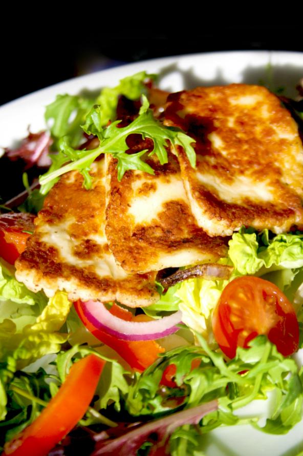 Warm salad of grilled halloumi slices, Puy lentils, roasted courgette, pepper, aubergine and rocket