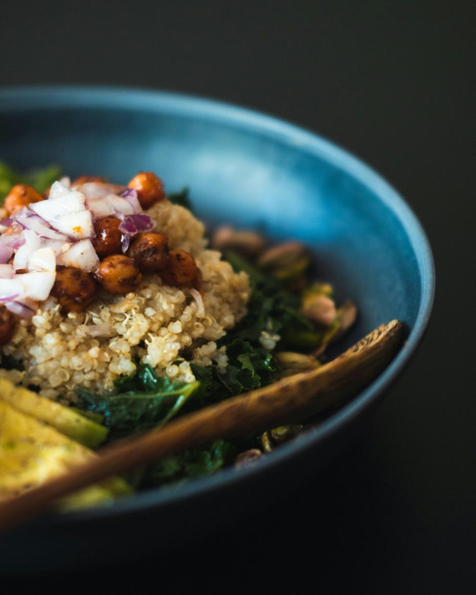 A quinoa bowl with Cajun-spiced prawns, mango salsa, sliced avocado, sweetcorn and rocket