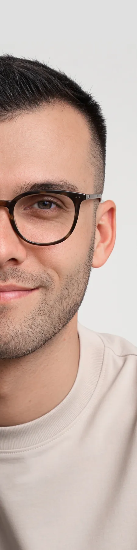 Close-up portrait of a man wearing glasses