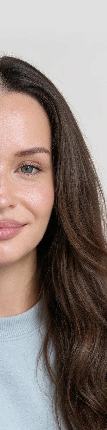 Close-up portrait of a woman with long brown hair