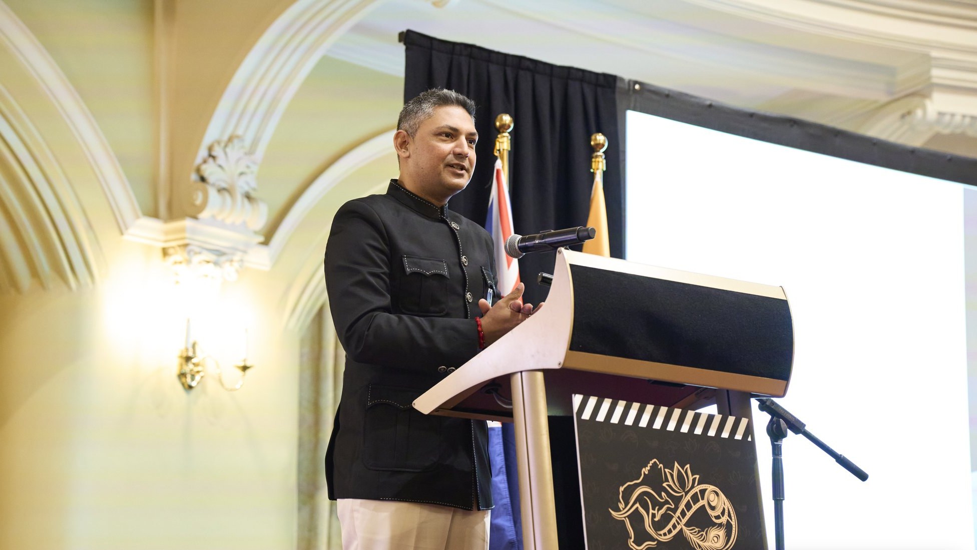 Nilesh Makwana, WAIFC Chair and Director, speaking at the lectern