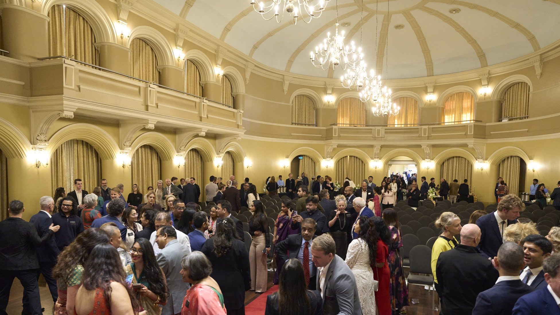 Guests mingling in the Government House Ballroom after the WAIFC launch