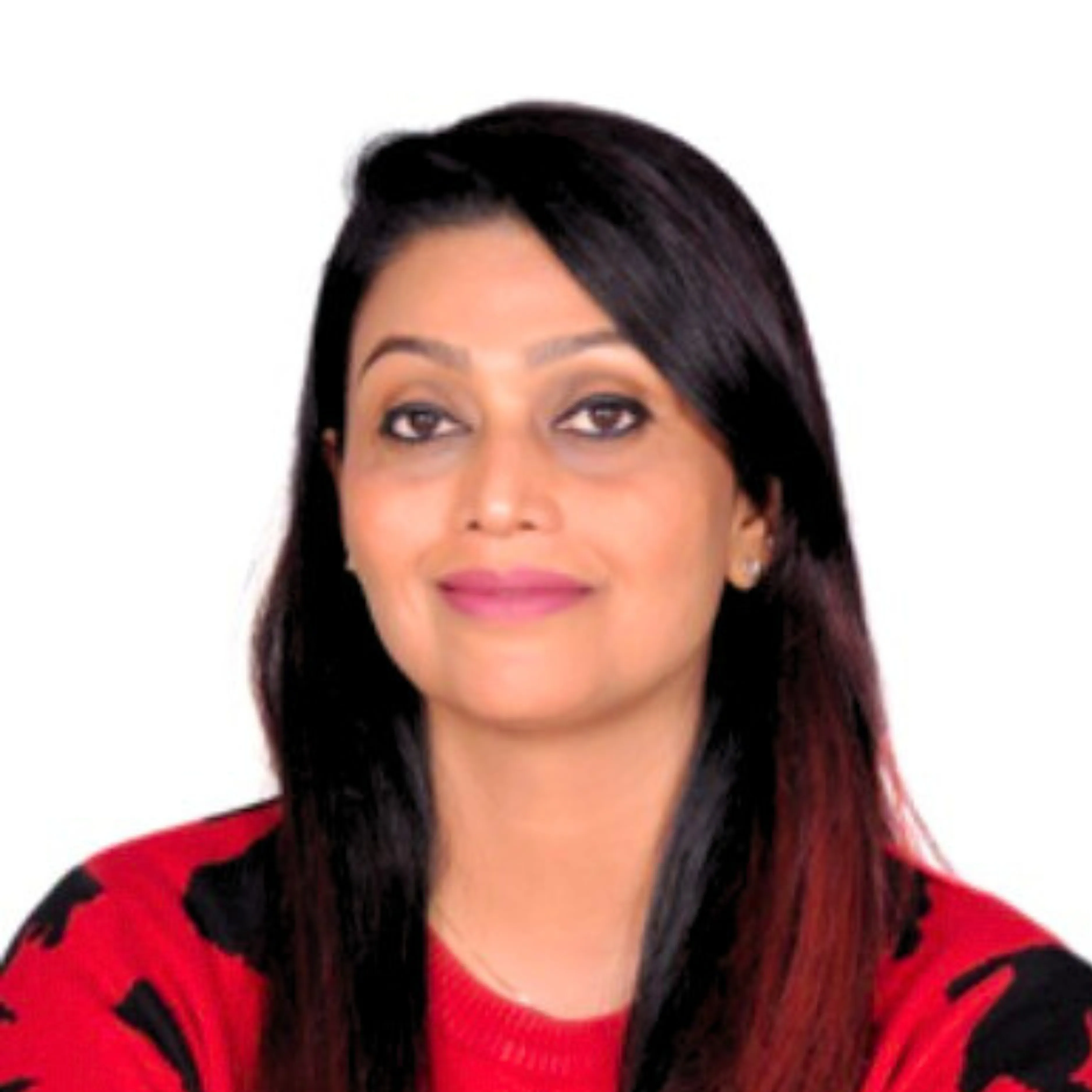 Woman with long dark hair wearing a red sweater with black patterns, smiling gently against white background.
