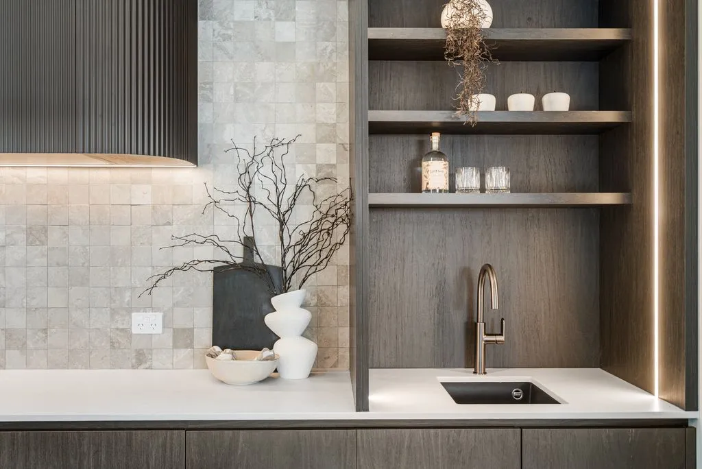 Contrasting dark cabinetry with light bench tops in a Christchurch home