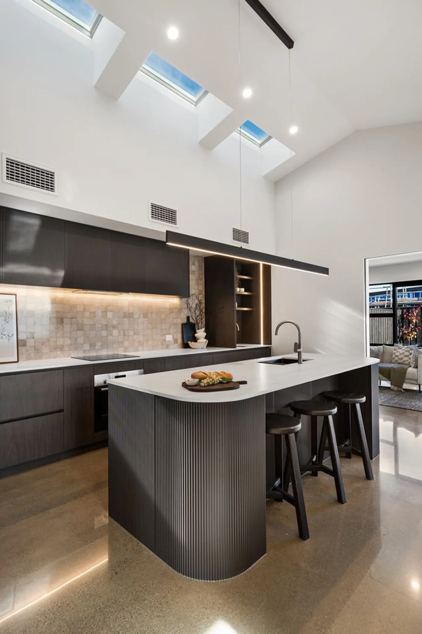 Custom dark curved panel kitchen cabinetry, Christchurch