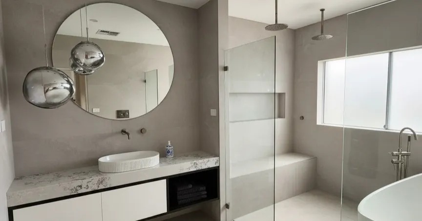 Freestanding bath and walk-in shower in a completed bathroom renovation