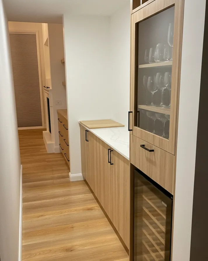 Custom timber cabinetry and flooring in a completed renovation