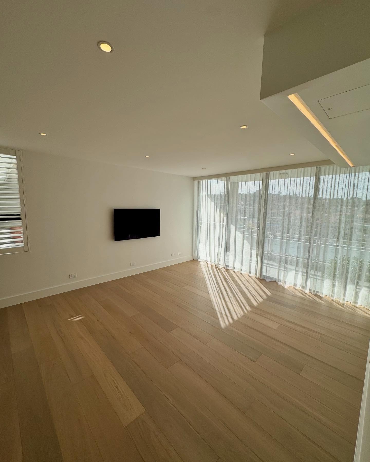 Engineered floorboards and integrated lighting in the renewed living space.
