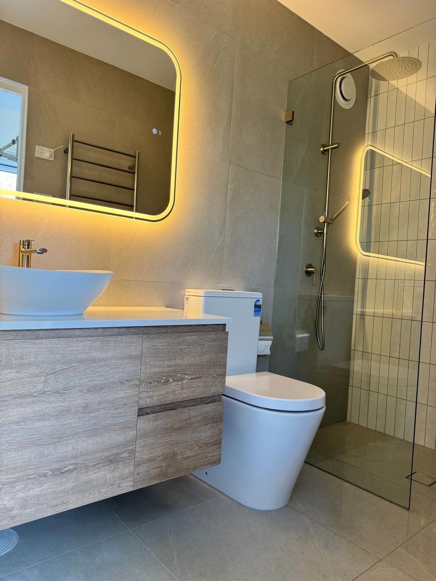 The second bathroom with integrated vanity lighting.