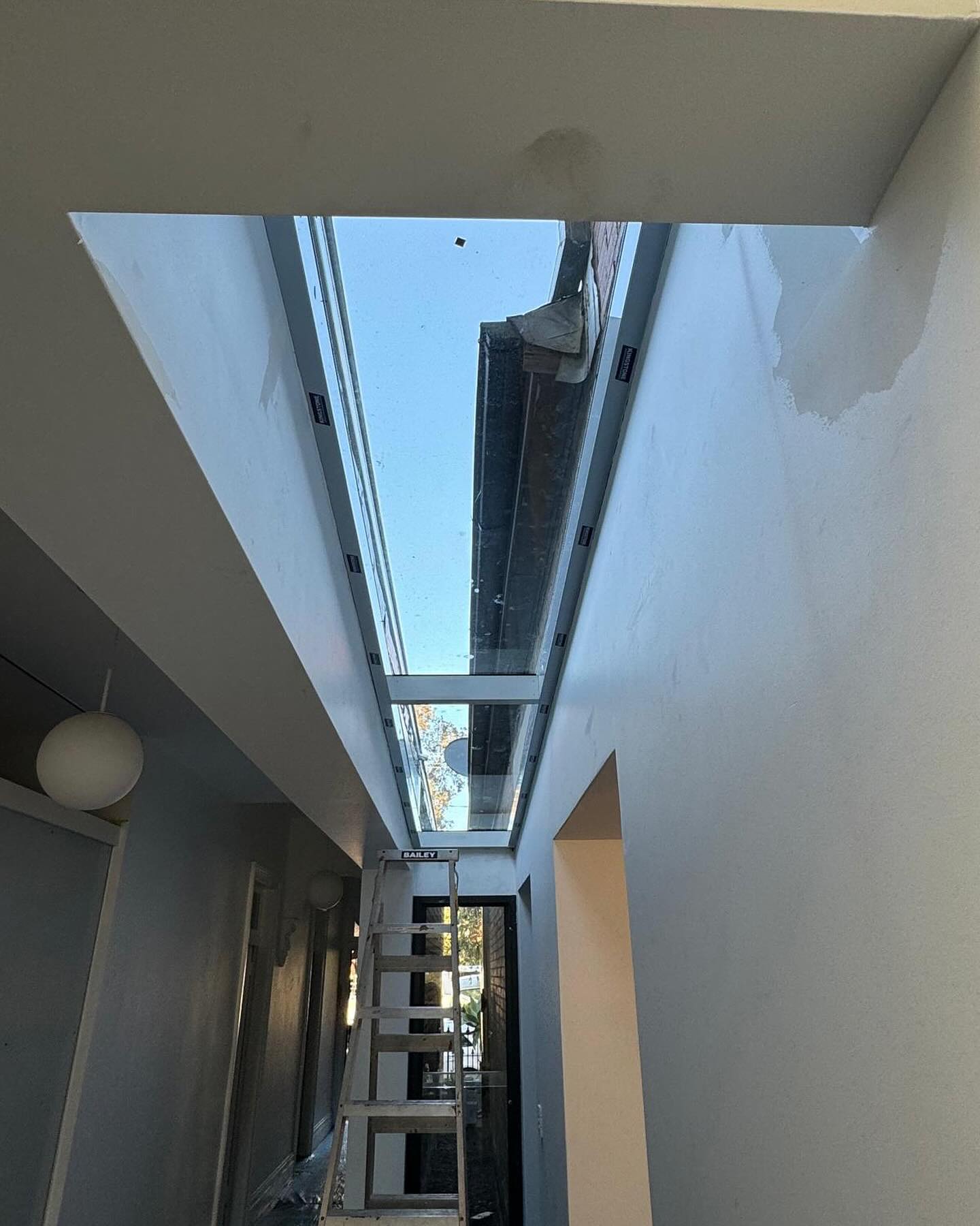 Skylight installation above the hallway.