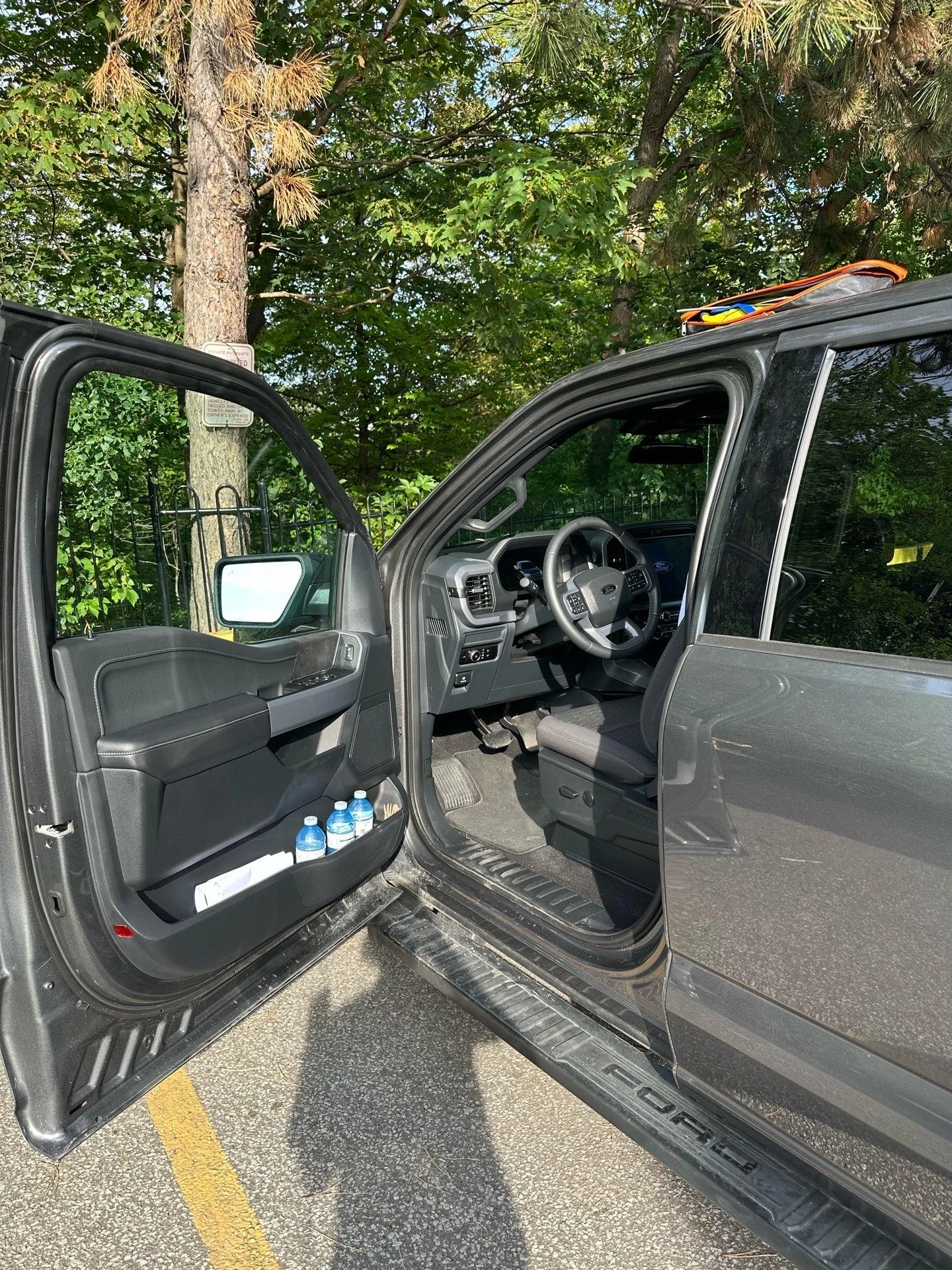 Car Unlock Service | Norman Towing Open driver door of a pickup truck after car unlock service by Norman Towing.