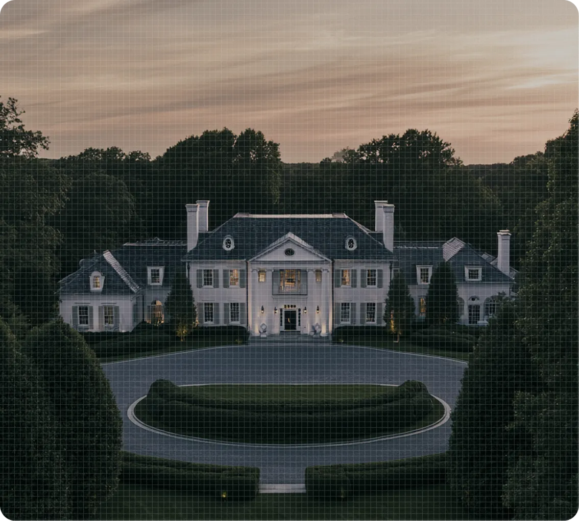 Large luxury estate surrounded by landscaped grounds representing protection services for executives, public figures, and private clients.