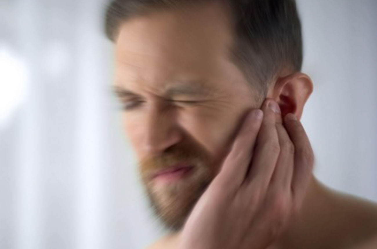 Man Suffering From Tinnitus