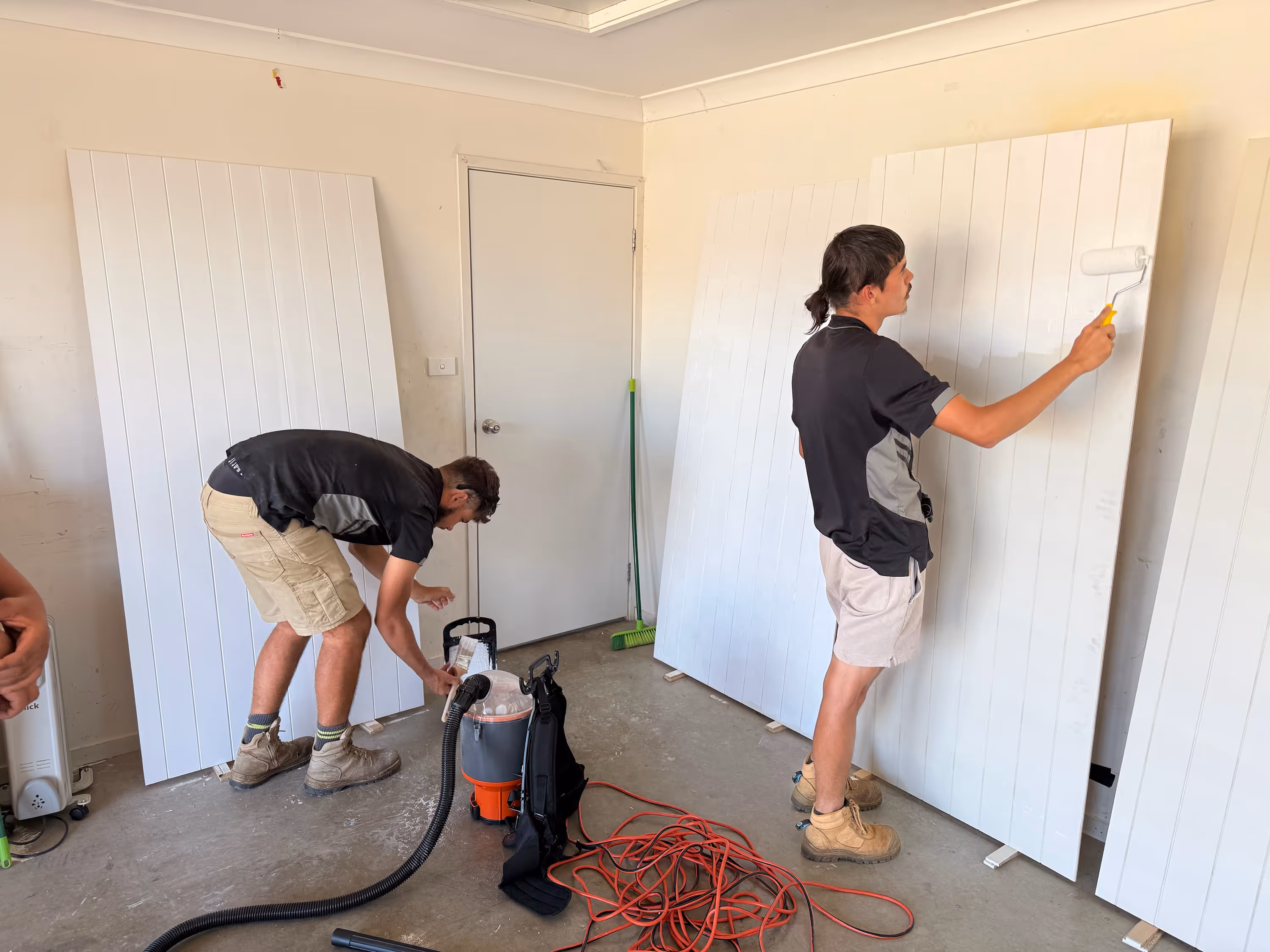 Fresh footprints participants paint walls in a house