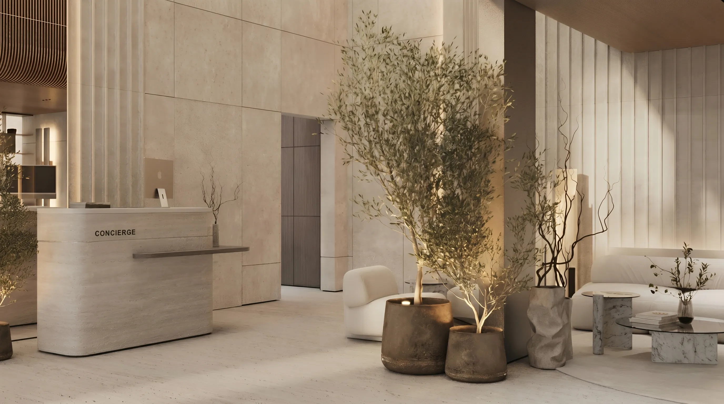 Minimalist beige concierge desk with potted plants and modern seating in a bright lobby area.