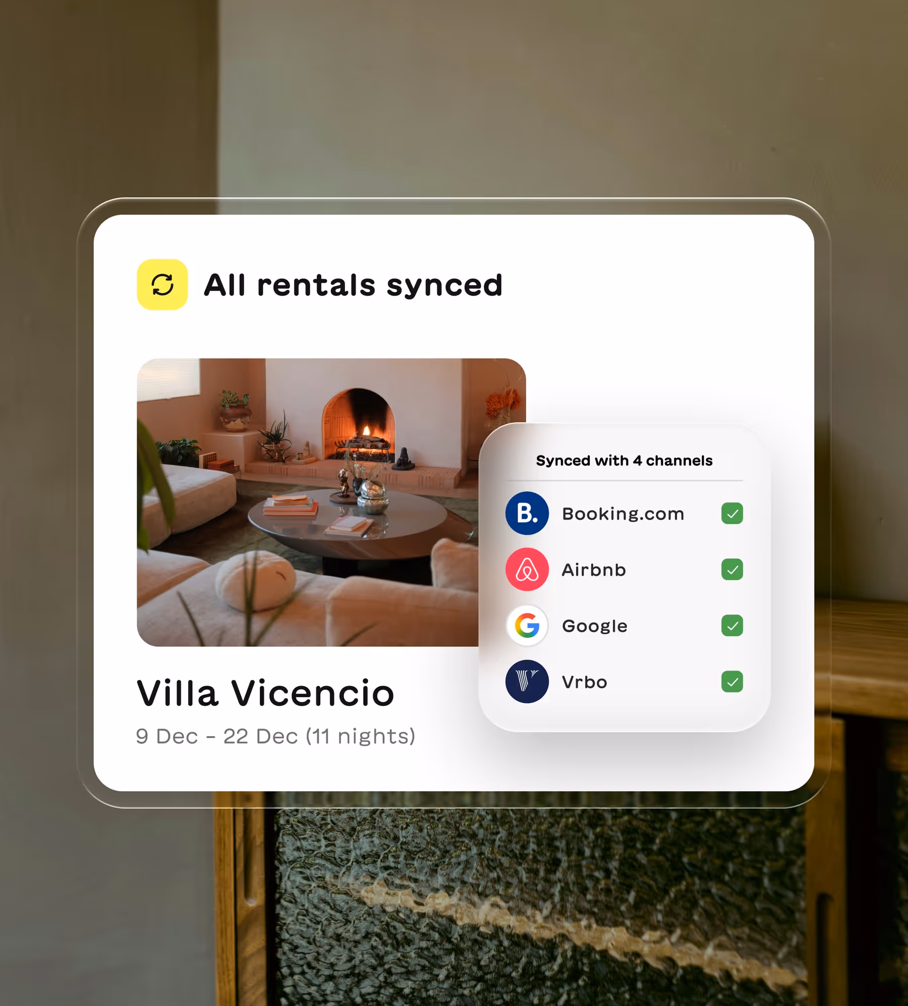 UI card showing rental property Villa Vicencio with a cozy living room and fireplace, synced across Booking.com, Airbnb, Google, and Vrbo.