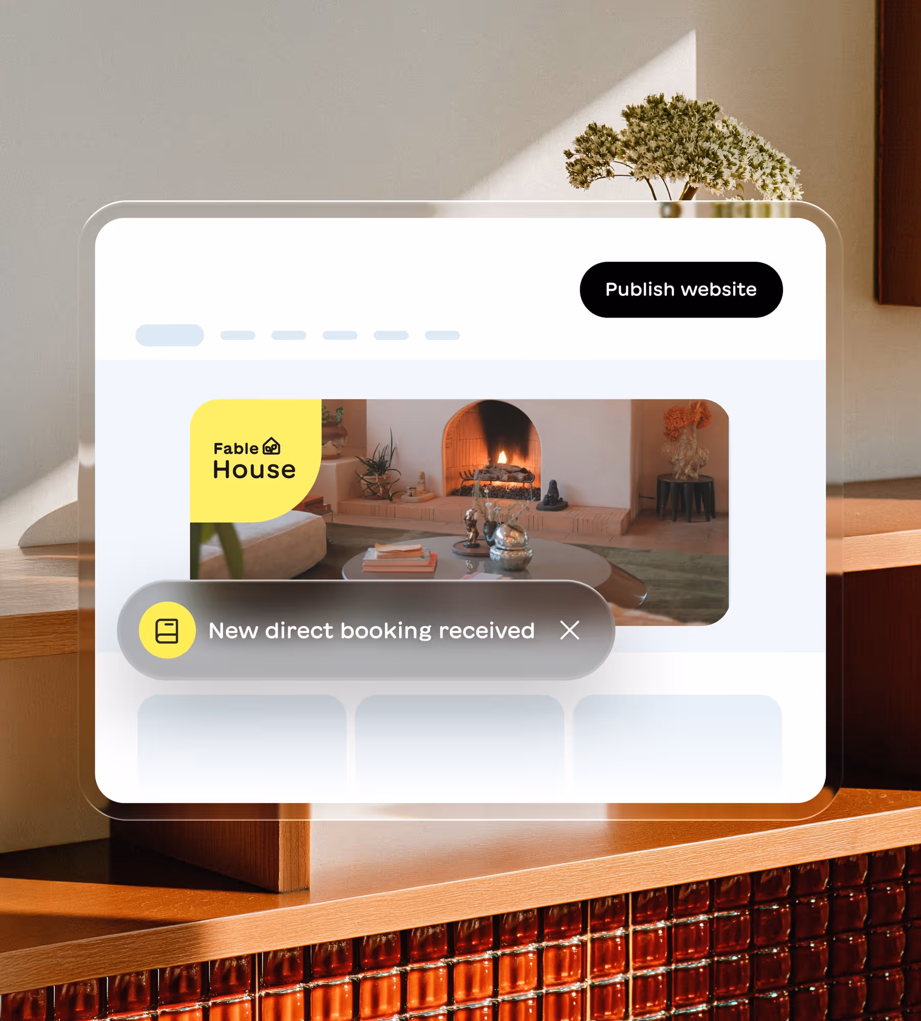 Website interface showing a booking notification for Fable House with a cozy living room image and a Publish website button.
