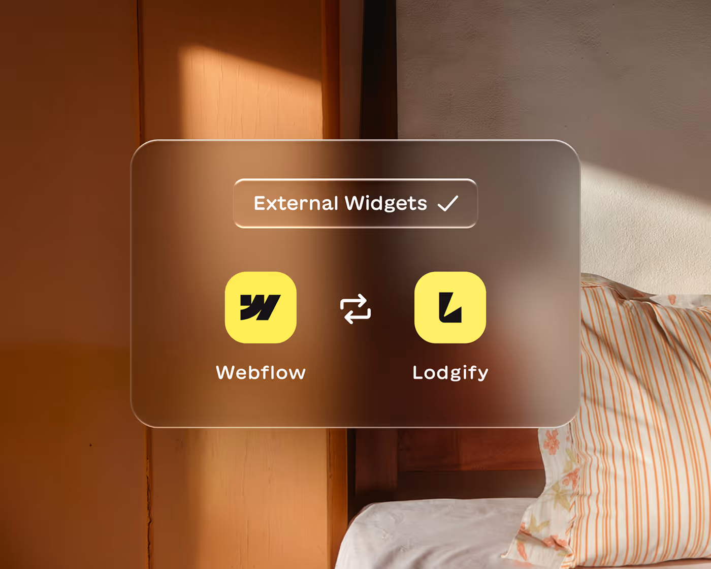 Interface panel showing integration between Webflow and Lodgify external widgets with their icons on a blurred background of a bed and wooden furniture.